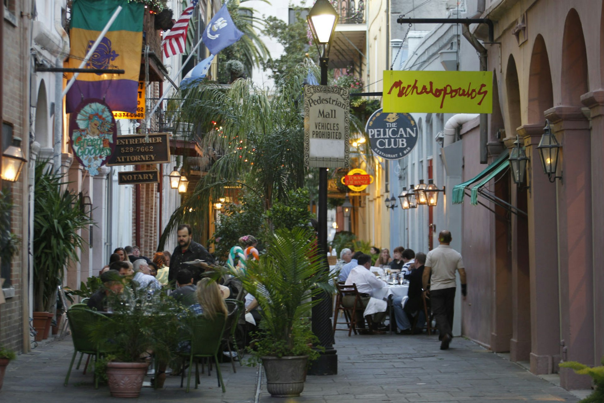 Lively restaurant alley in the French Quarter. Image courtesy of New Orleans Convention and Visitors Bureau.