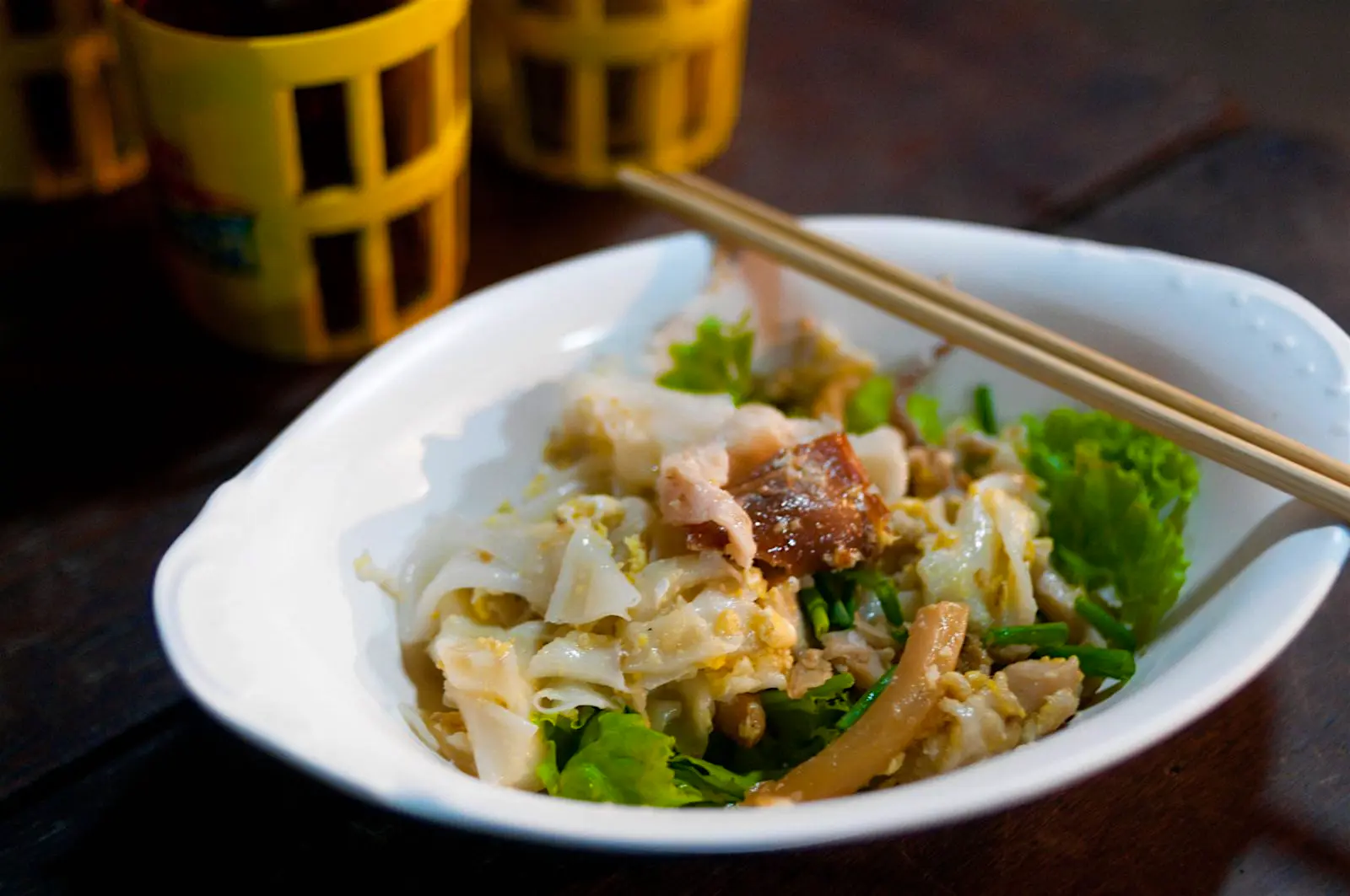Features - A dish of gooay teeo kooa gai, rice noodles fried with chicken and egg, as sold in Bangkok’s Chinatown © Austin Bush / Lonely Planet