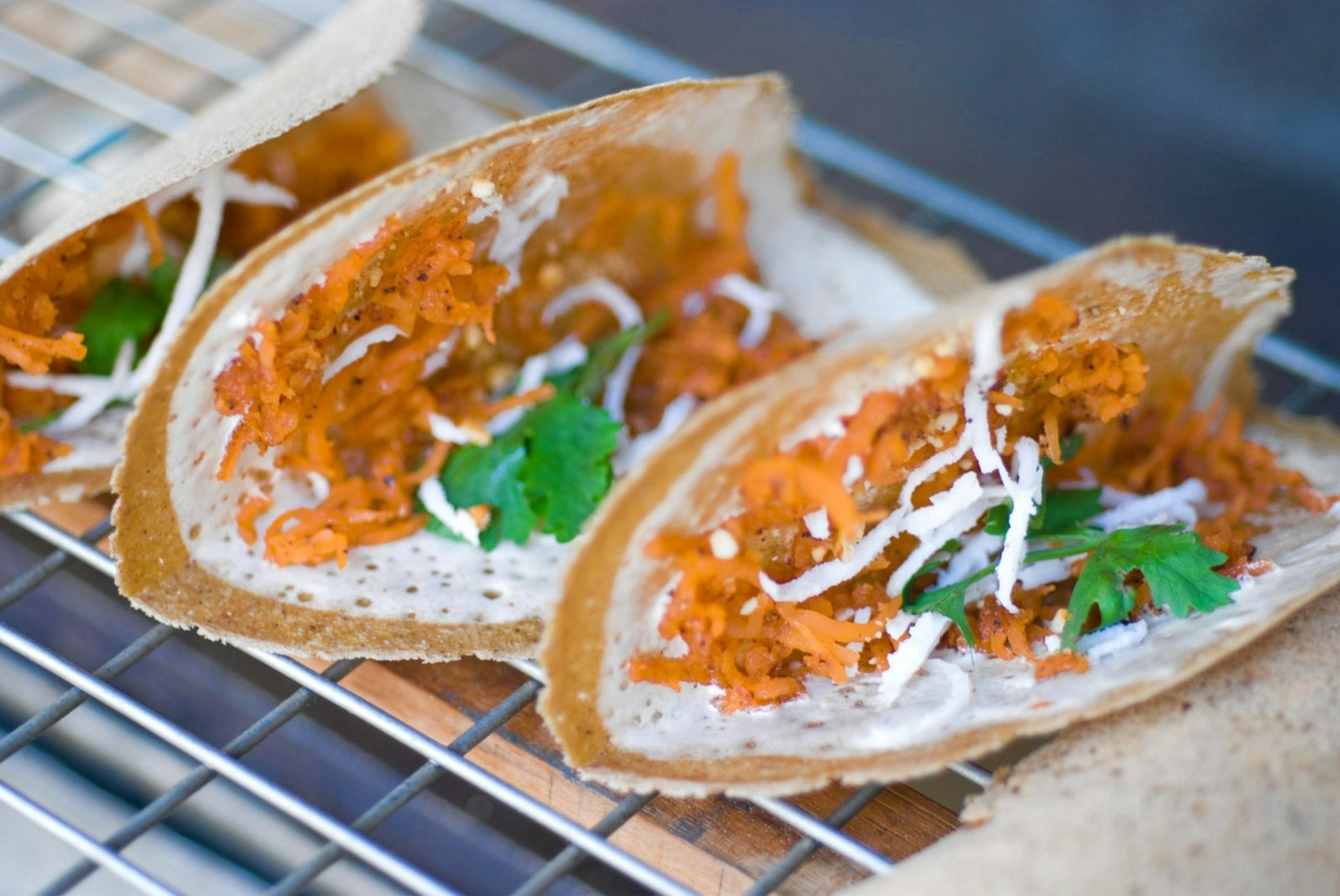 Kanom beuang, sweet and savoury taco-like snacks, for sale on the streets of Bangkok © Austin Bush / Lonely Planet