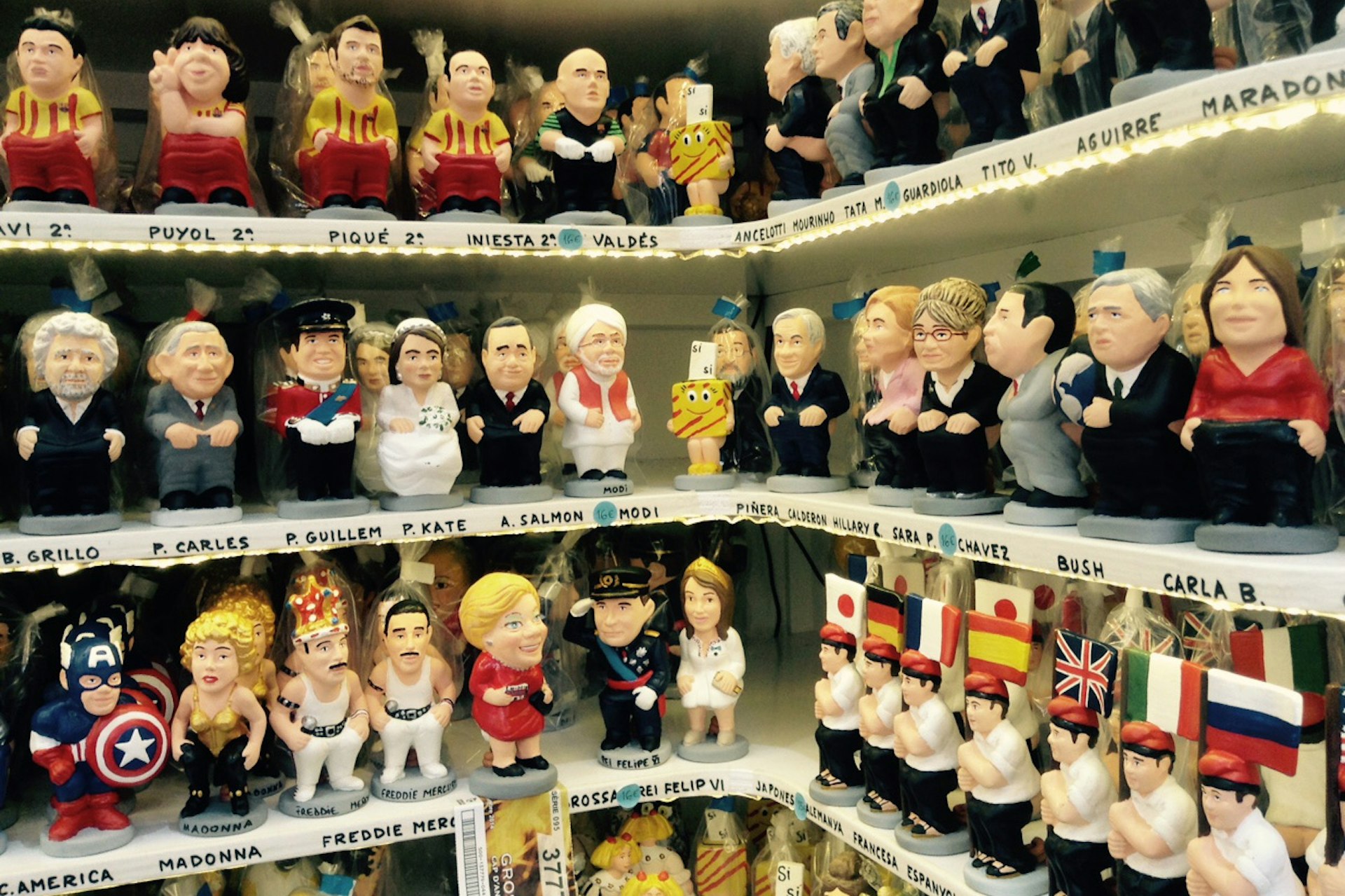 Some familiar faces take on the role of caganer at Christmas in Barcelona. Image by Sally Davies / Lonely Plane