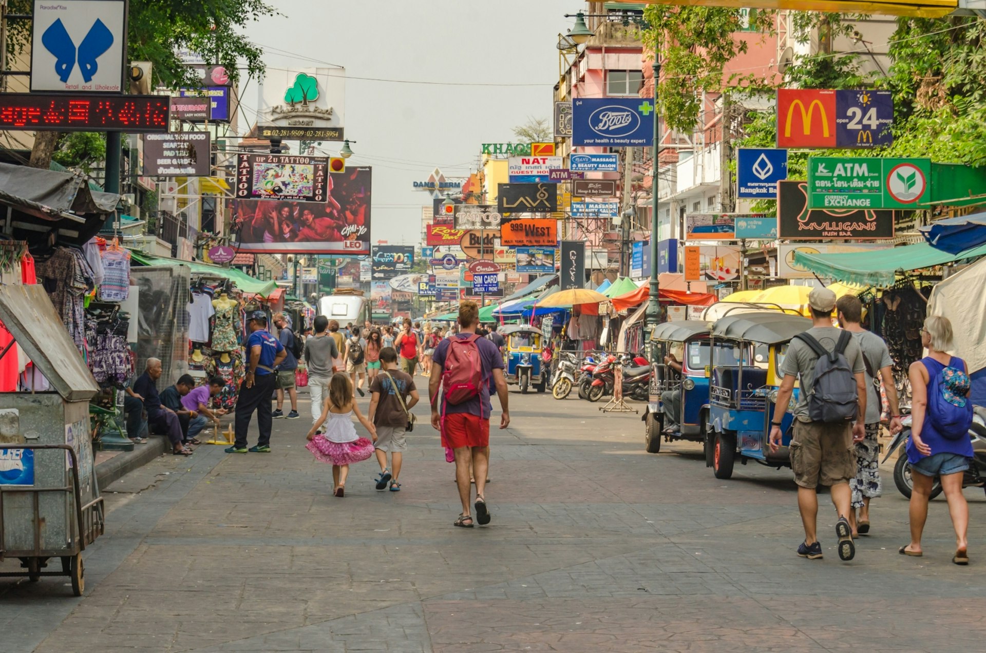 Visitors exploring Khao San street market in Bangkok © Man of Stocker city / Shutterstock