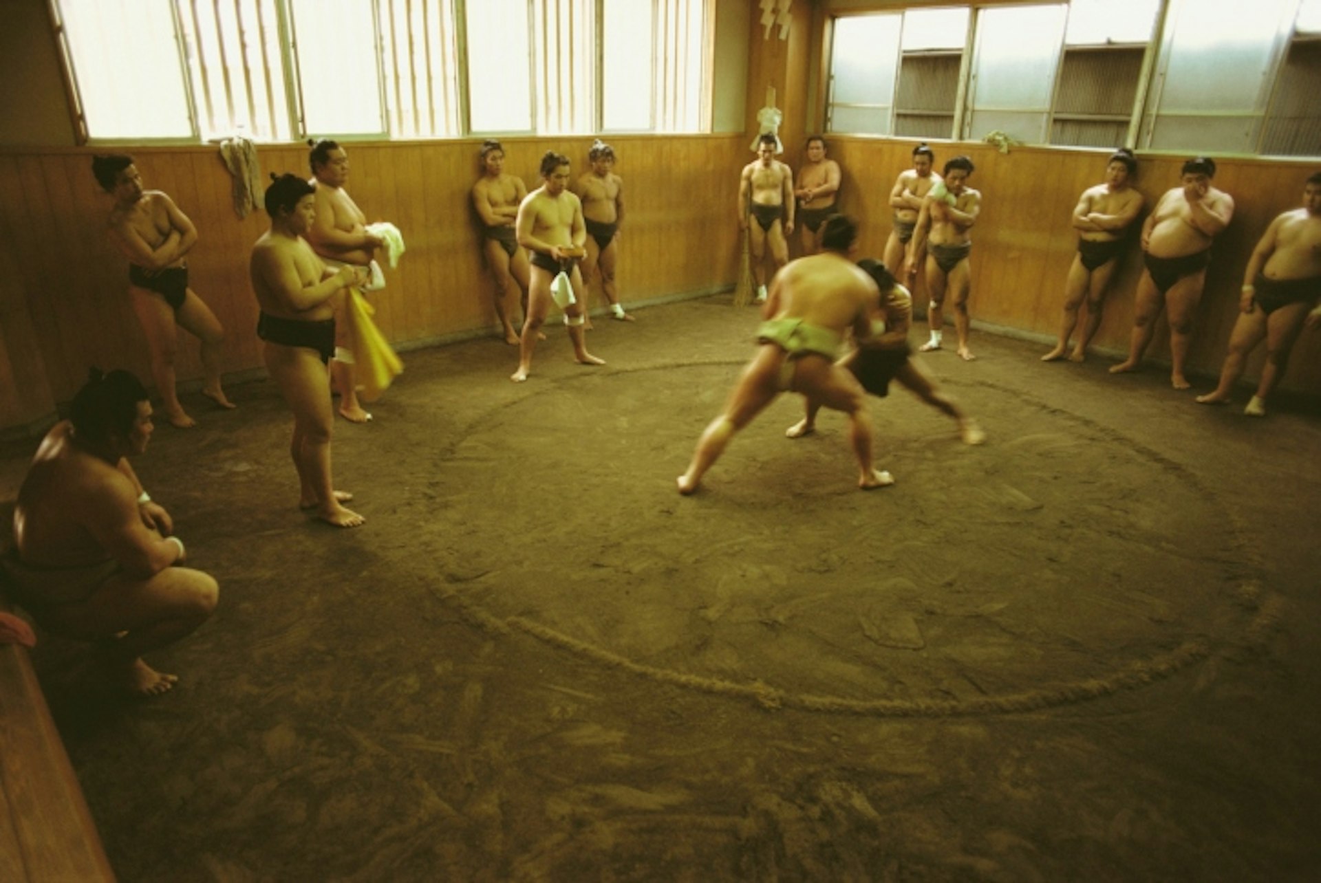 Sumo wrestlers training in Tokyo Prefecture. Photo by Glowimages / Getty Images