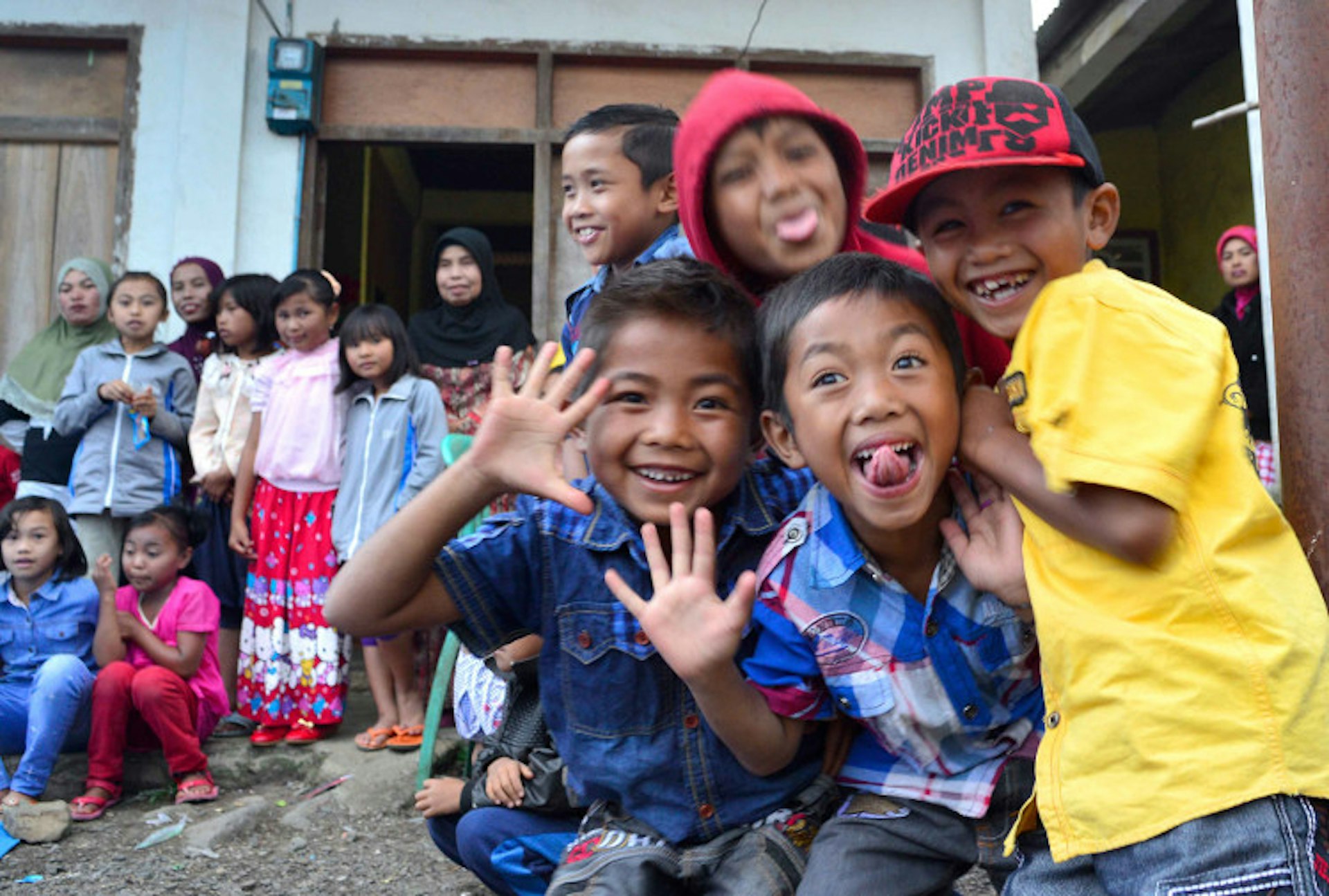 Friendly faces of Pelompek, a popular Gunung Tujuh trekking basecamp. Image by Mark Eveleigh