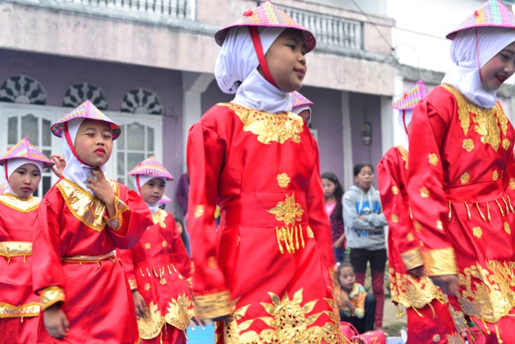 Young women in Pelompek, Sumatra practice the ceremonial dance known as Tari Rangguk, a celebration of their traditional rice-farming lifestyle. Image by Mark Eveleigh