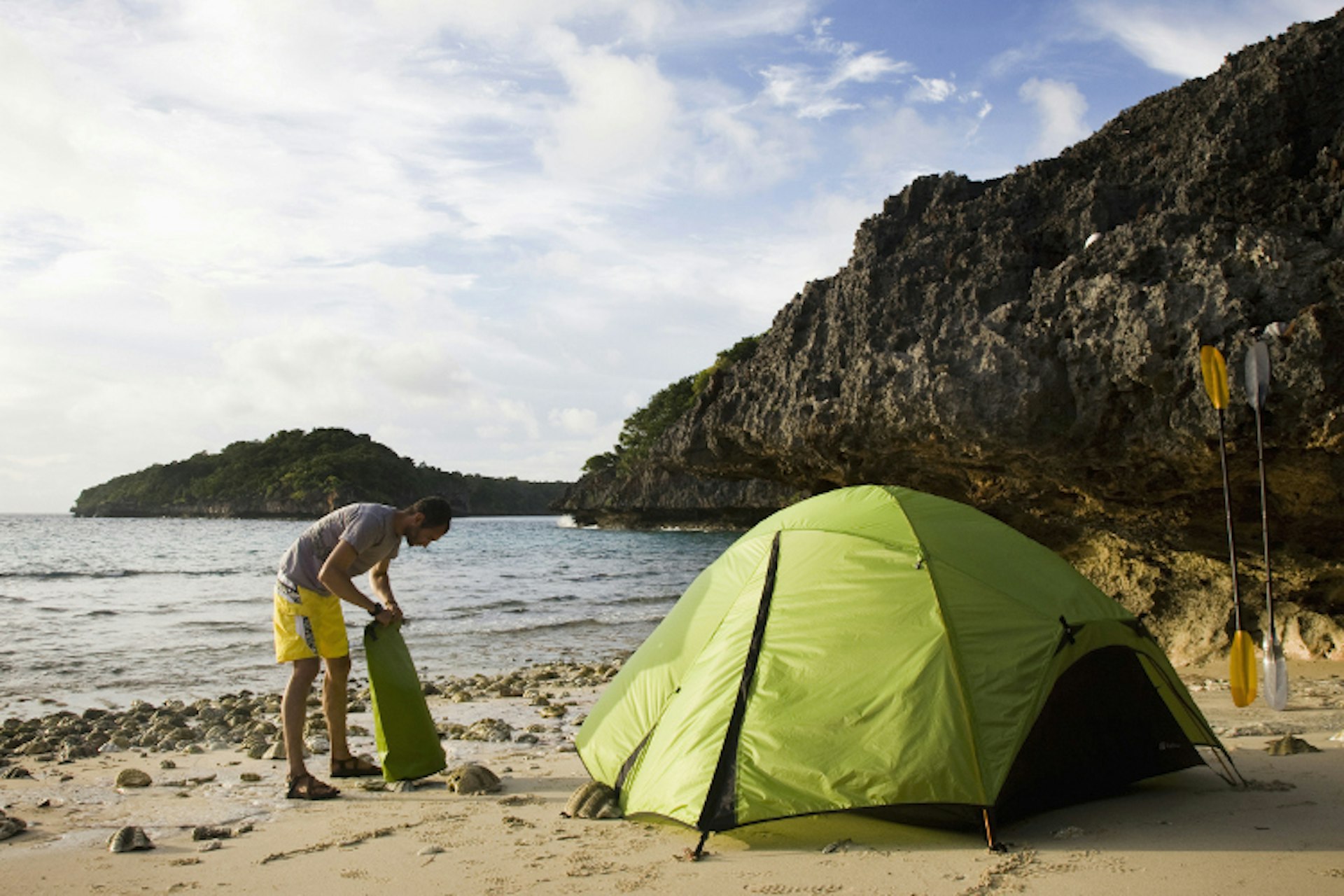 Setting up camp on a remote beach in Fiji. Image by Michael Hanson / Getty Images