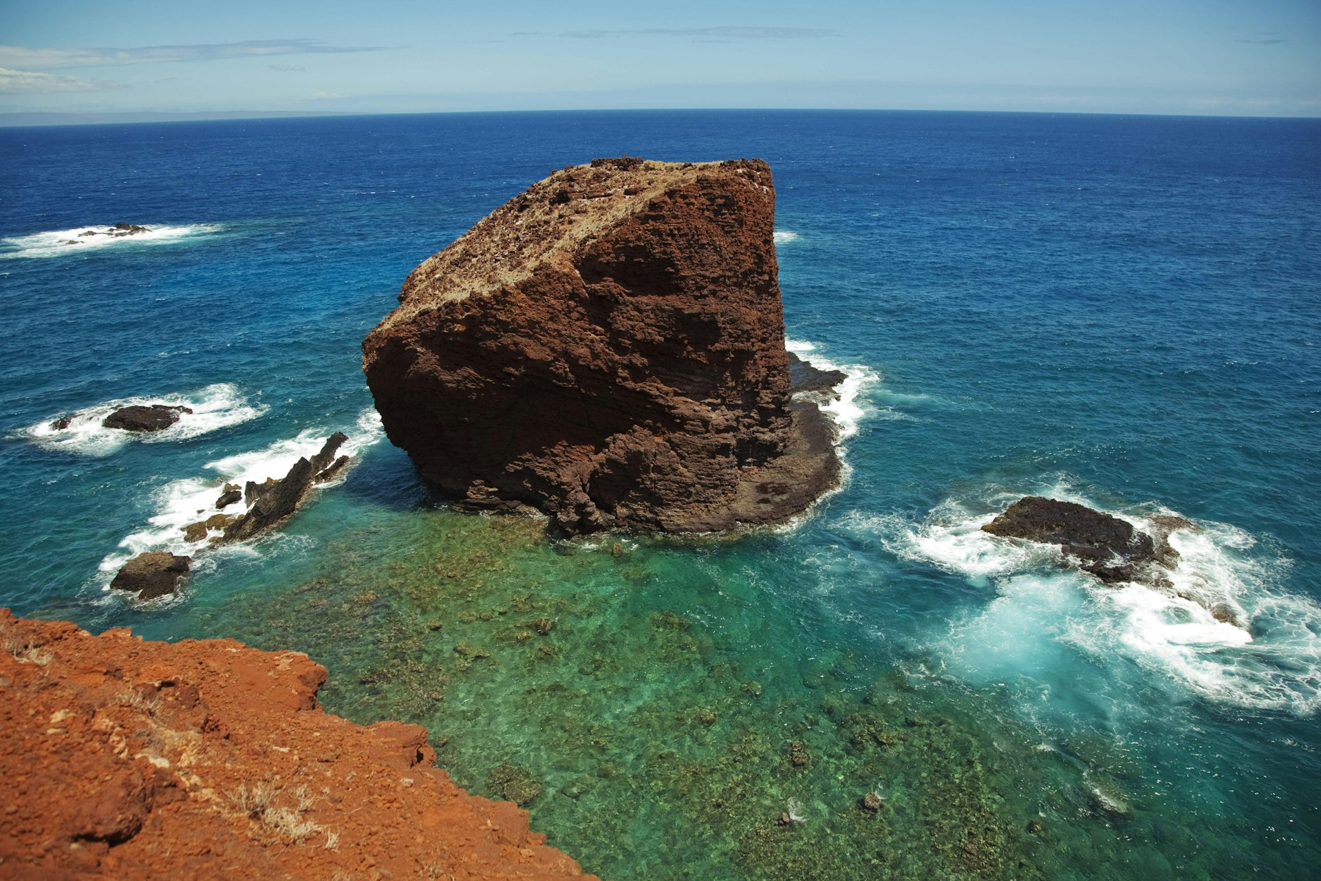 Legend has it that Sweetheart Rock near Lana‘i was the site where a young warrior plunged to his death after losing his lover to the sea. Image by Ron Dahlquist / Perspectives / Getty