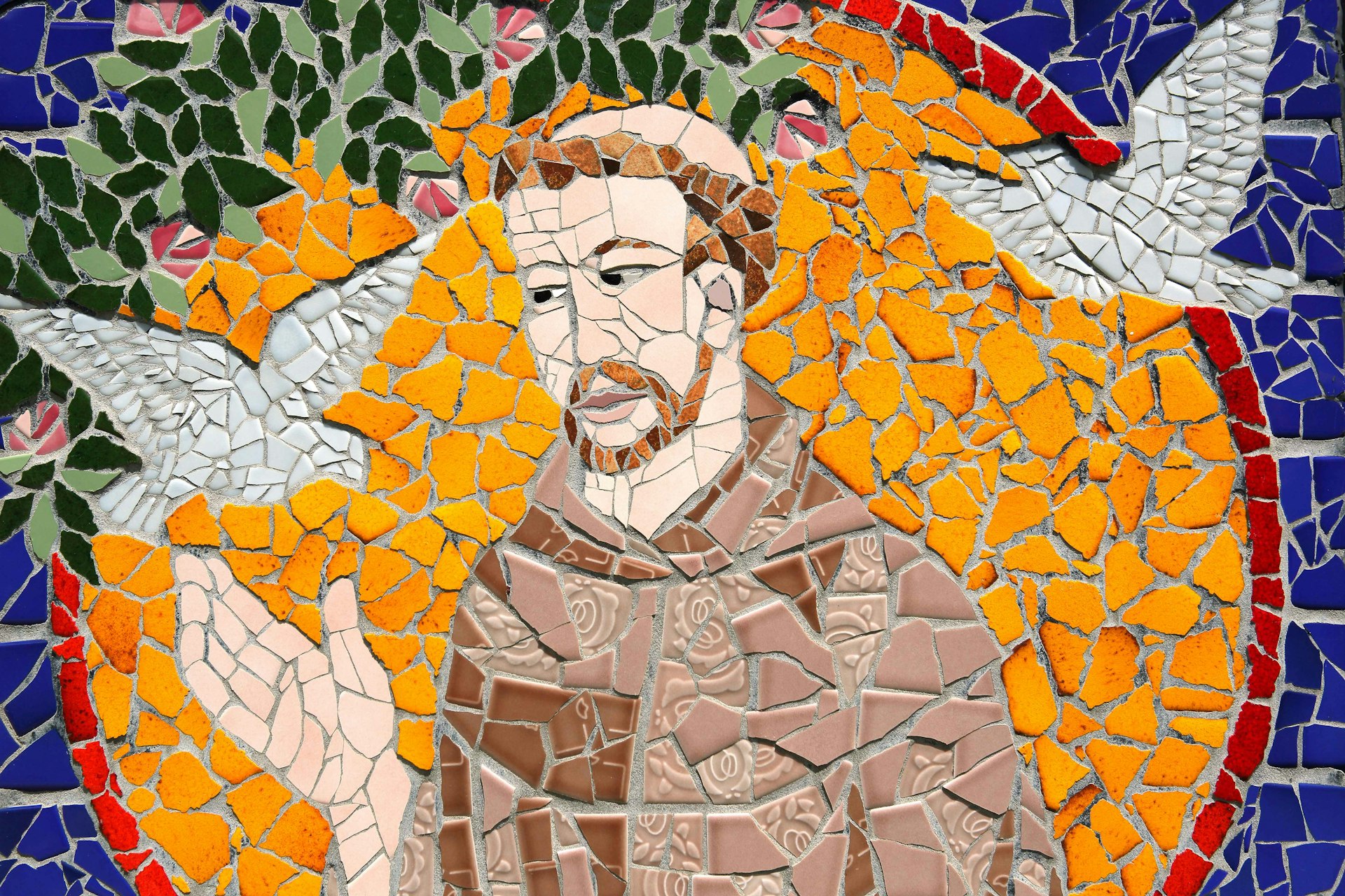 This mural, located near the entrance of the St. Francis Church on Moloka'i, depicts St. Francis of Assisi. Image by Steven Greaves / Getty