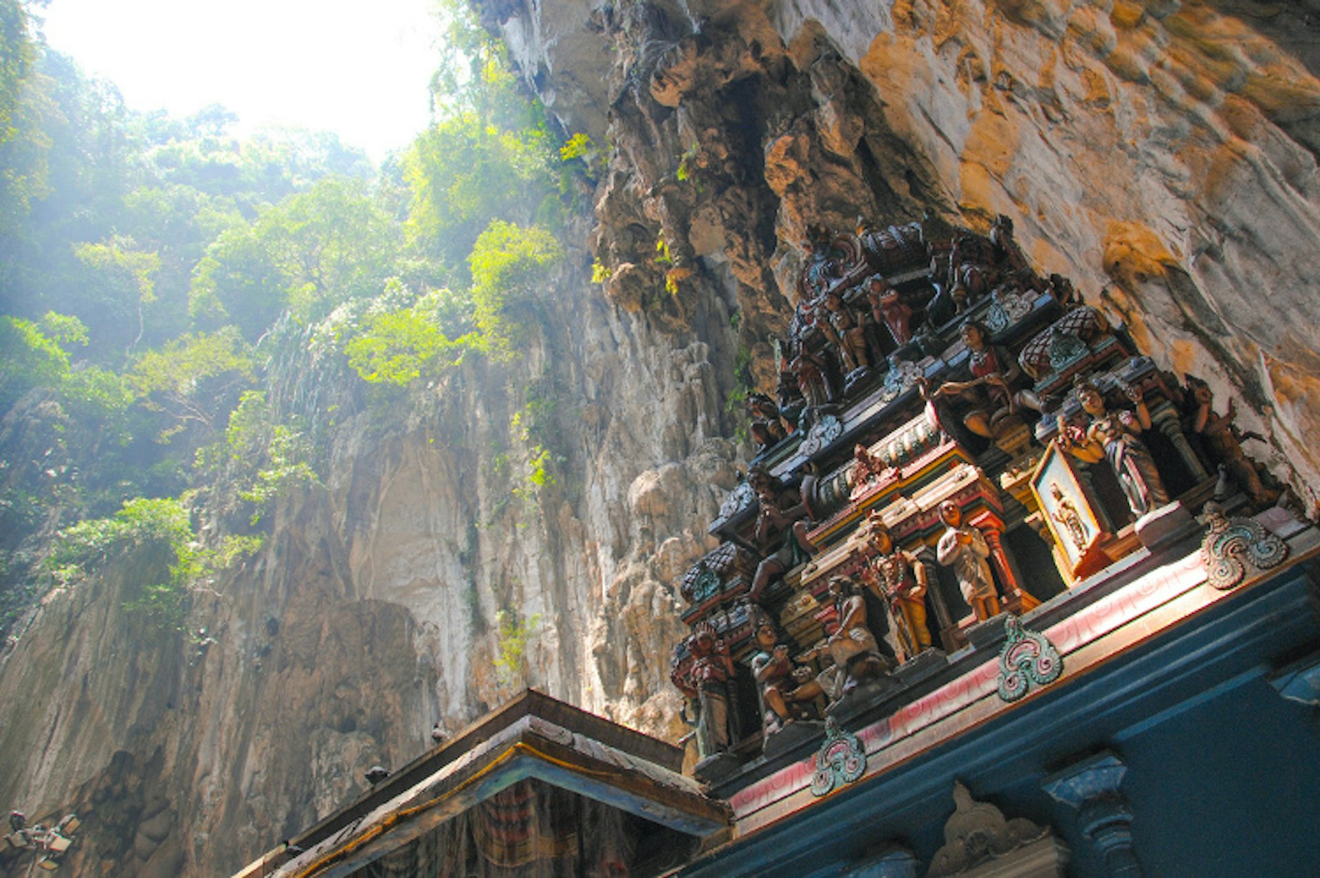Vertiginous cliffs and shadowy caves are an impressive setting for Batu Caves near KL. Image by LWYang / CC BY 2.0