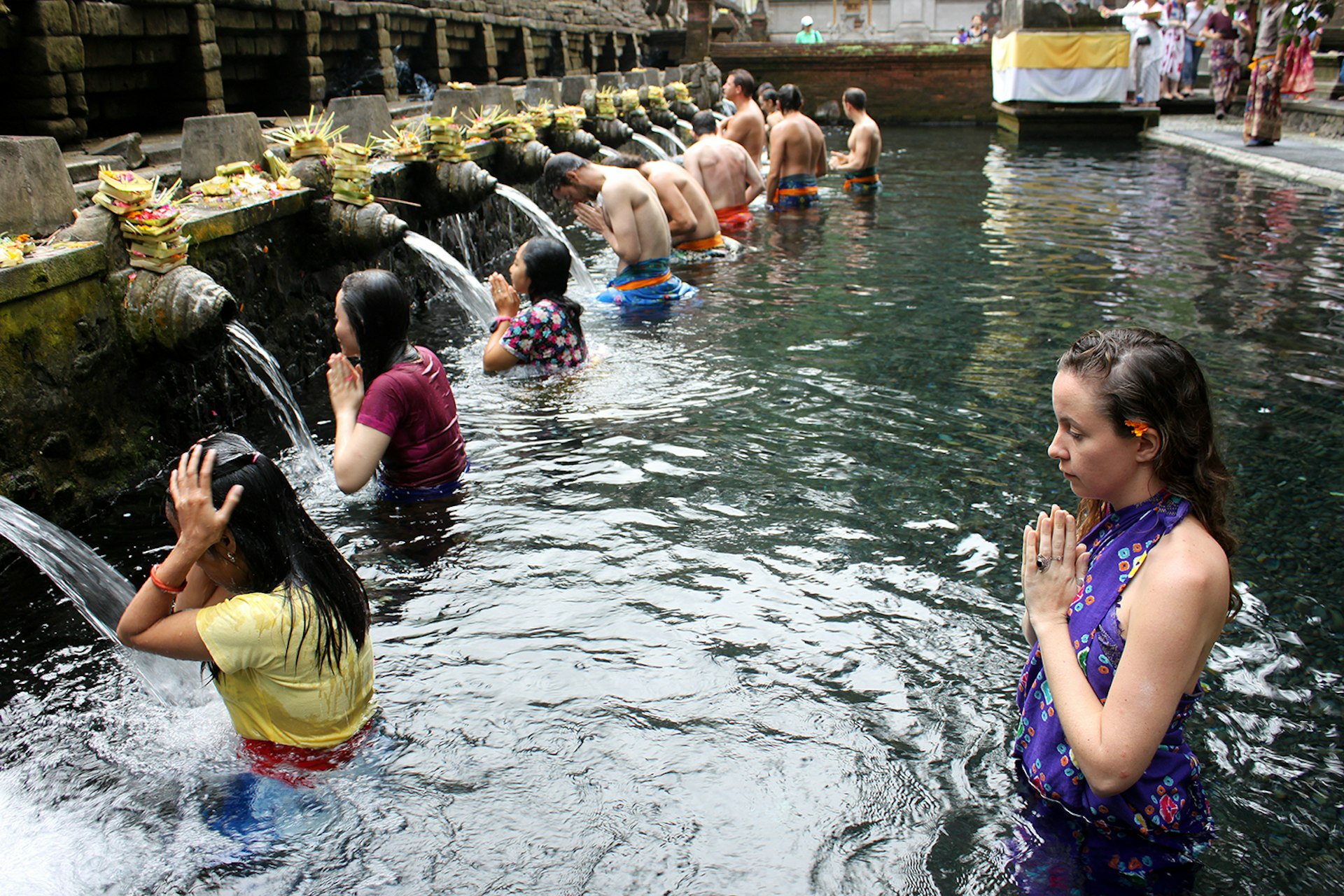 The holy bathing site of Tirta Empul Temple. Image by Samantha Chalker / Lonely Planet