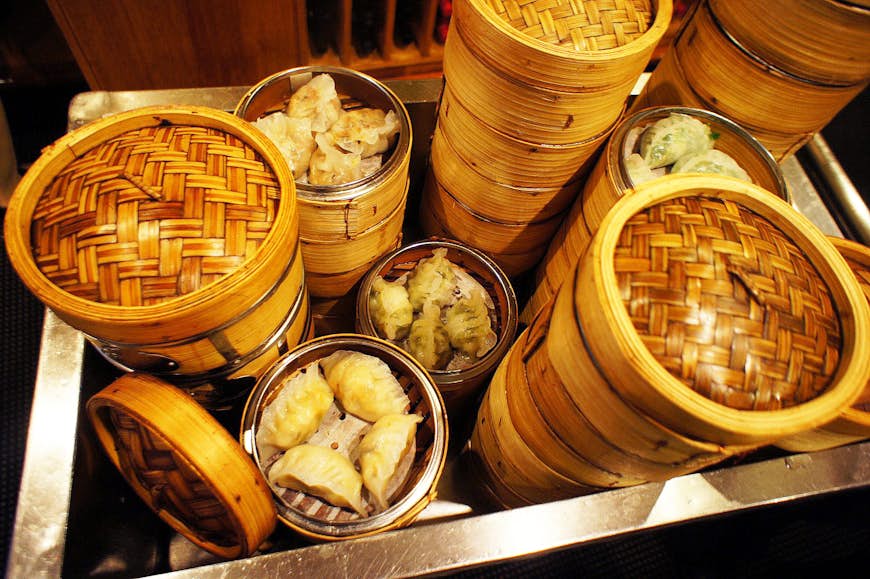 Baskets of dim sum piled higher than a Sydney skyscraper. Image by Phillip Tang / Lonely Planet