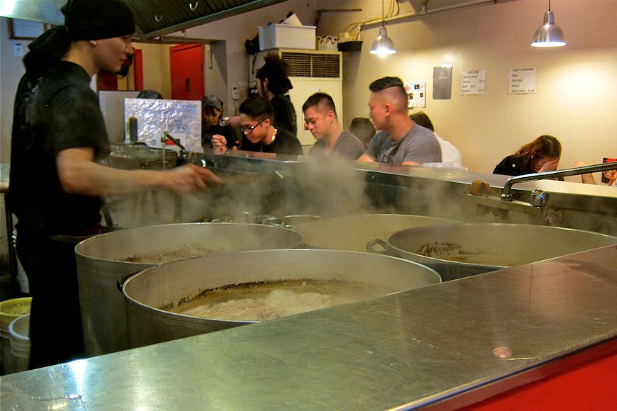The counter overlooks the steaming kitchen area at Kintaro. John Lee / Lonely Planet