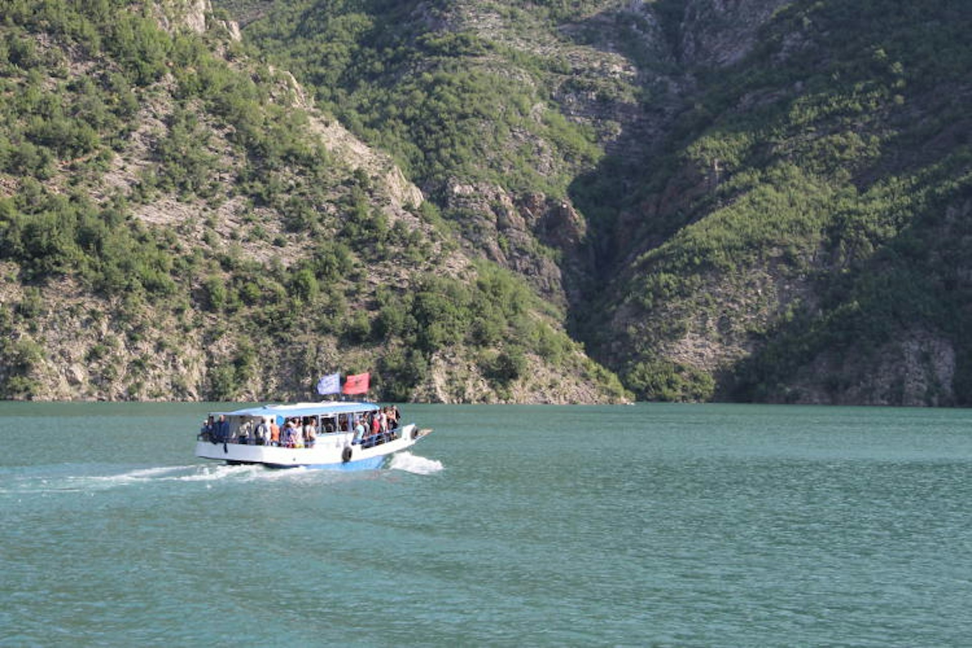 The Dragobia setting out across Lake Koman towards Fierzë. Image by Tom Masters / Lonely Planet