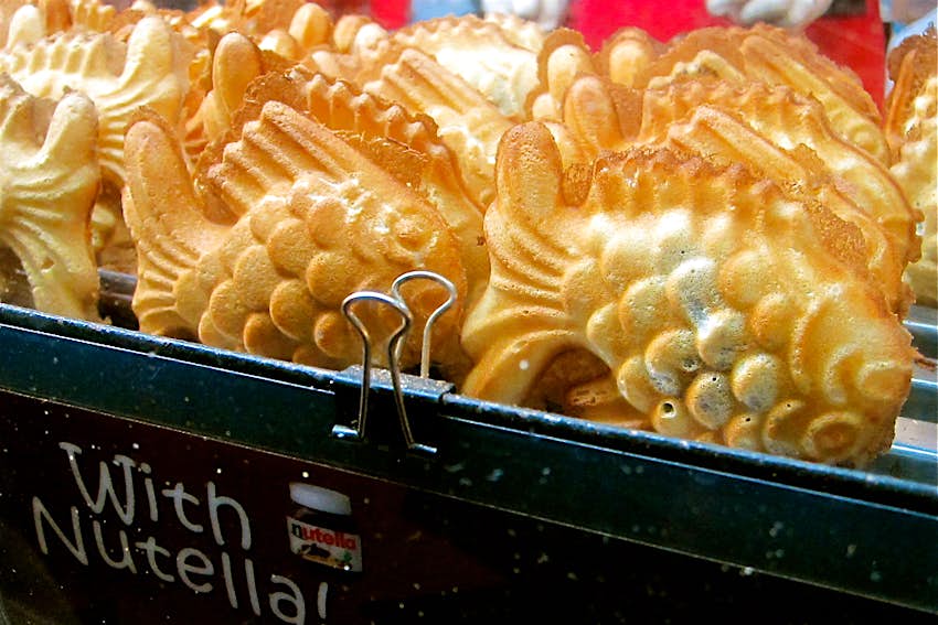 Richmond Night Market A close up of fish-shaped Nutella-filled waffles in a metal container.