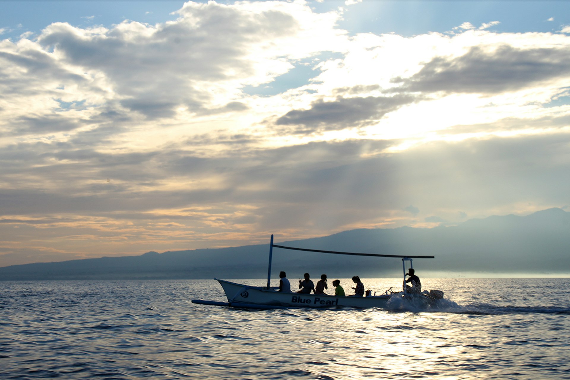 Don't consider yourself a morning person? A sunrise boat ride in North Bali might change that. Image by Samantha Chalker / Lonely Planet