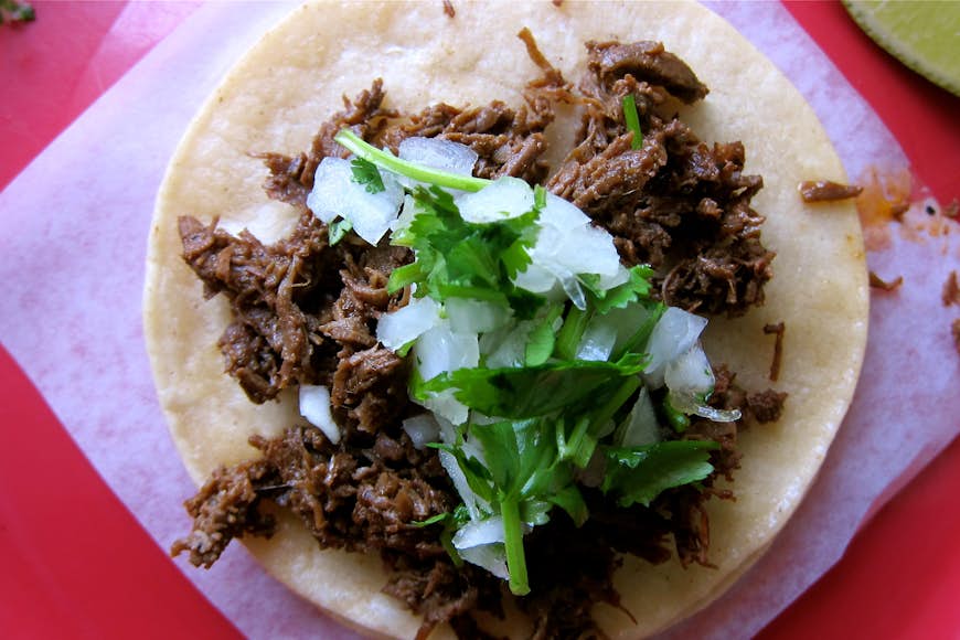 A tasty, fresh-made taco at La Taqueria Pinche Taco Shop. Image by John Lee / Lonely Planet