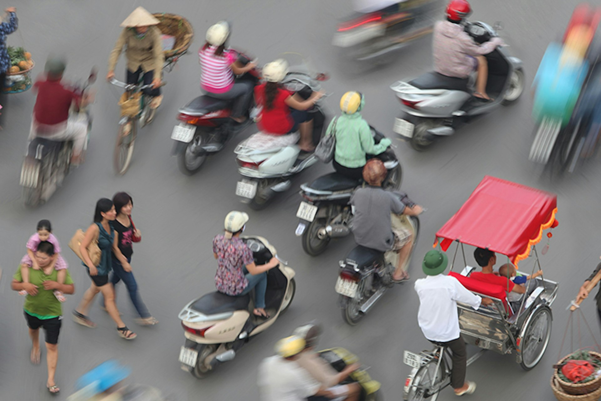 Don't dither when you're crossing the road in Vietnam. Image by Per-Andre Hoffmann / Picture Press / Getty Images