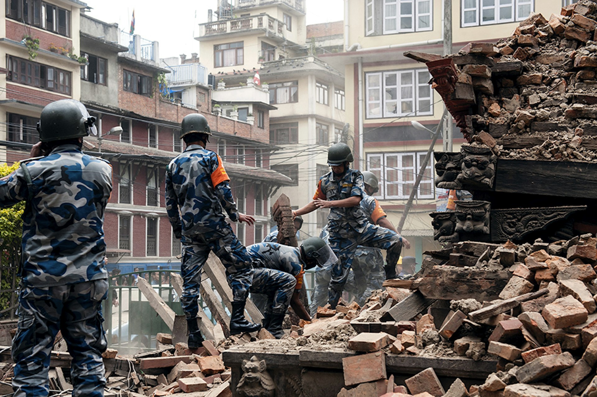 Rescue workers comb through rubble in Kathmandu