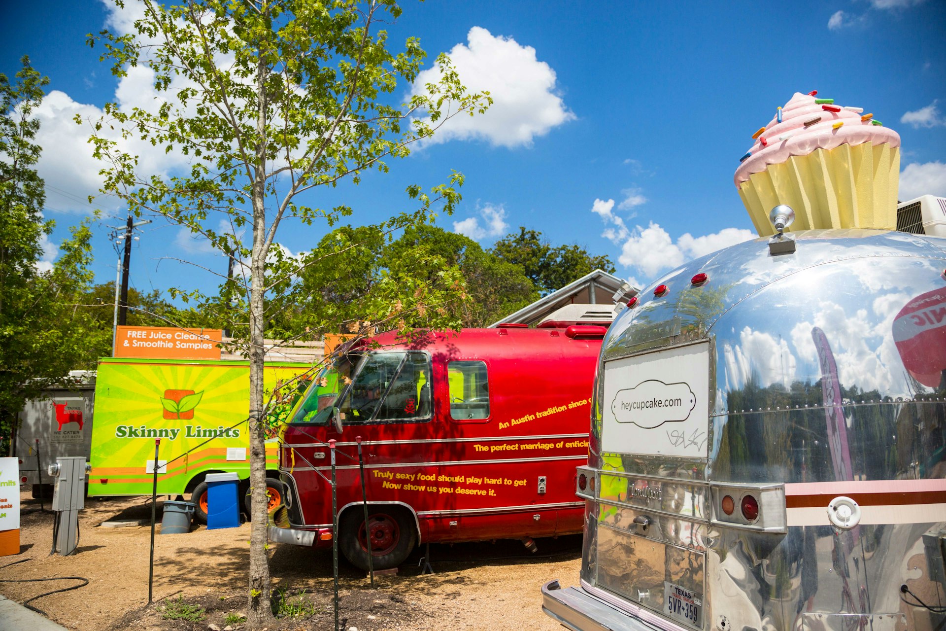 Food trucks lined up in the Barton Springs Picnic area. Image by Kylie McLaughlin / Getty