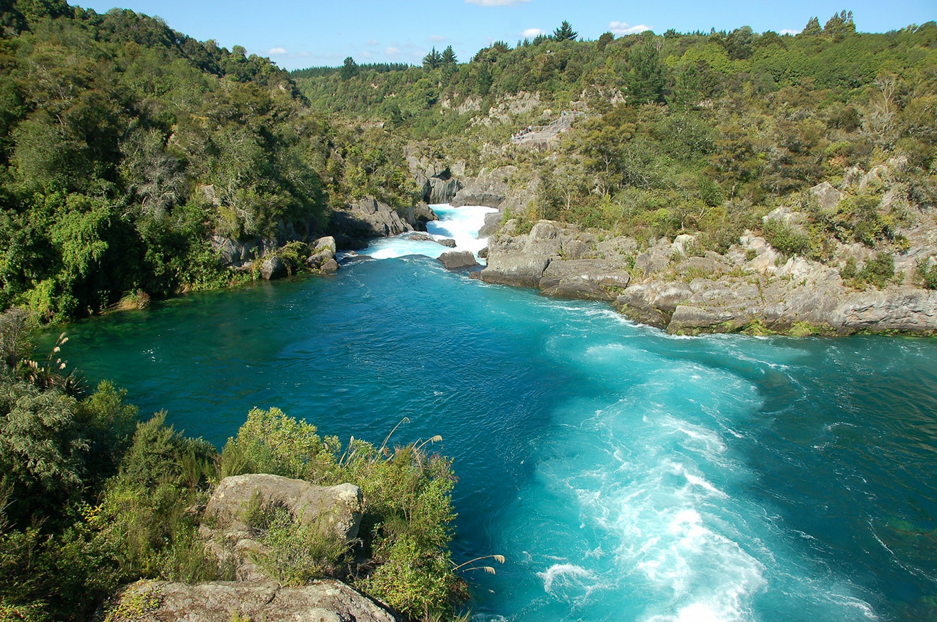 Huka Falls' riverside trails give cyclists stunning views of New Zealand's Aratiatia Rapids. Image by Krzysztof Belczyński / CC BY-SA 2.0