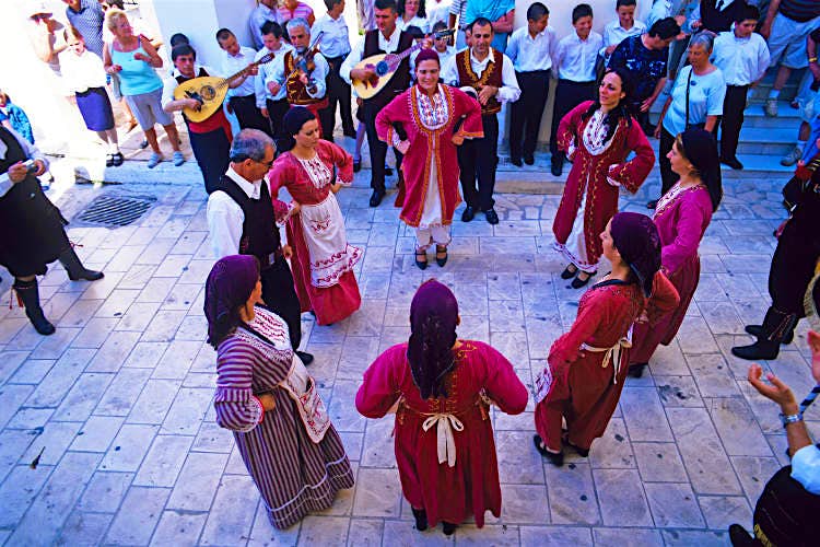 Features - Festival-dancing-Bouzouki-St Mark's Square-Zakynthos_cs Festival dancing with Bouzouki instruments, St Mark's Square,Zakynthos. Image by Adina Tovy / Lonely Planet Images / Getty Images