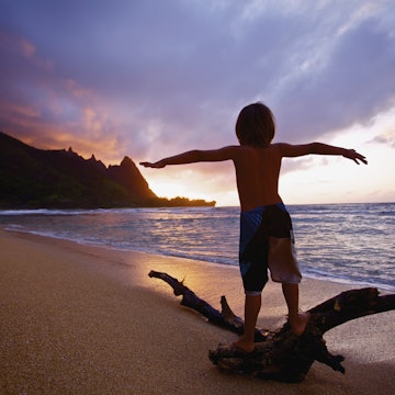 Tunnels Beach on Kauaʻi at sunrise. Image by Kicka Witte / Design Pics / Getty