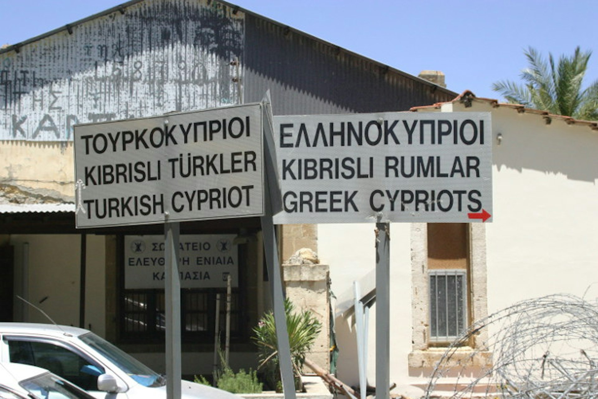 Signs in Greek, Turkish and English near Ledra Palace checkpoint, Nicosia. Image by Christopher S Rose / Getty Images