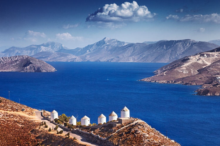 Coastal windmills on Leros, now converted into small hotels. Image by Matt Munro / Lonely Planet