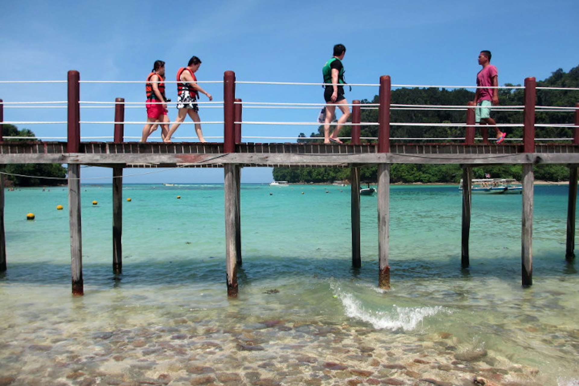 Pulau Sapi, left, connected to Pulau Gaya, right, via a zipline, is an easy day trip option from Kota Kinabalu. Image by Sarah Reid Lonely Planet