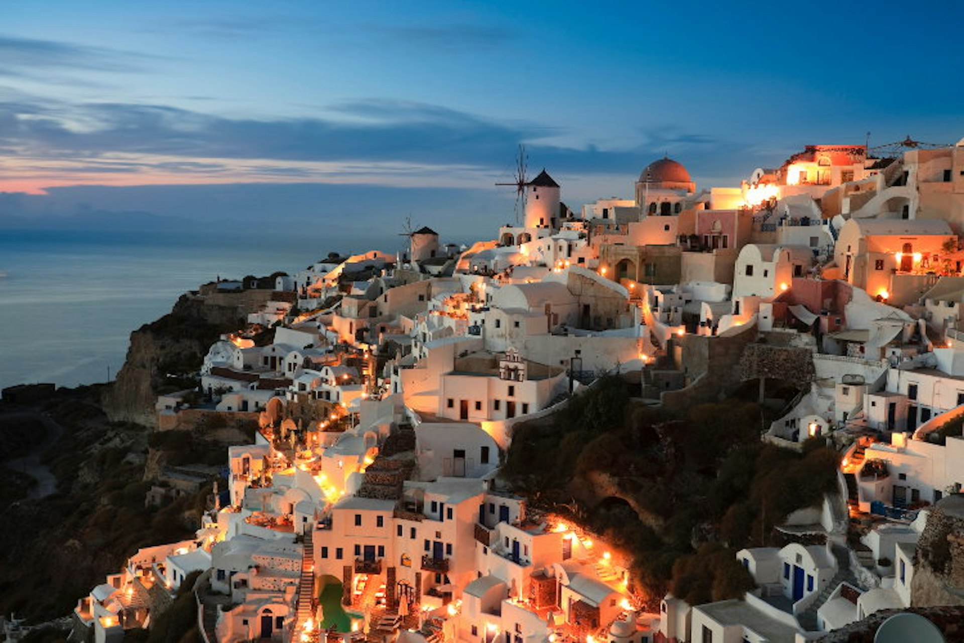 The famous Santorini sunset. Image by Hanquan Chen / Getty Images