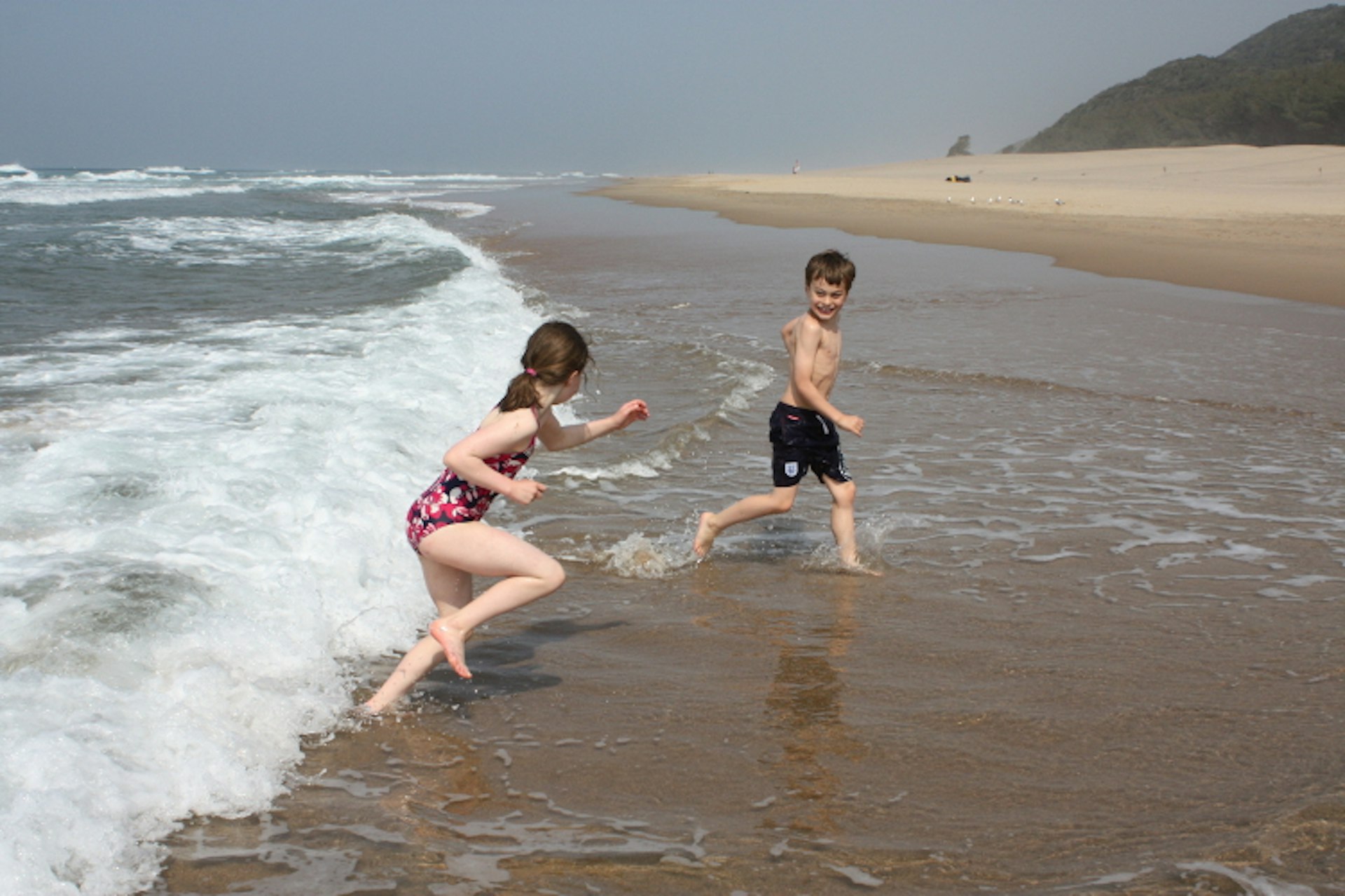 Playing in the surf at iSimangaliso Wetland Park, South Africa. Image by David Else / Lonely Planet