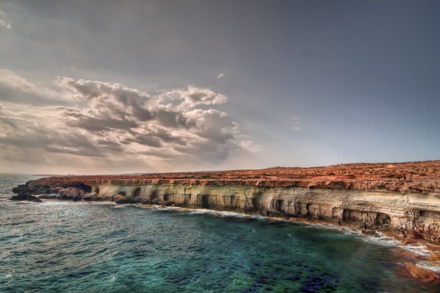 Sea caves at Cape Greco. Image by Getty Images