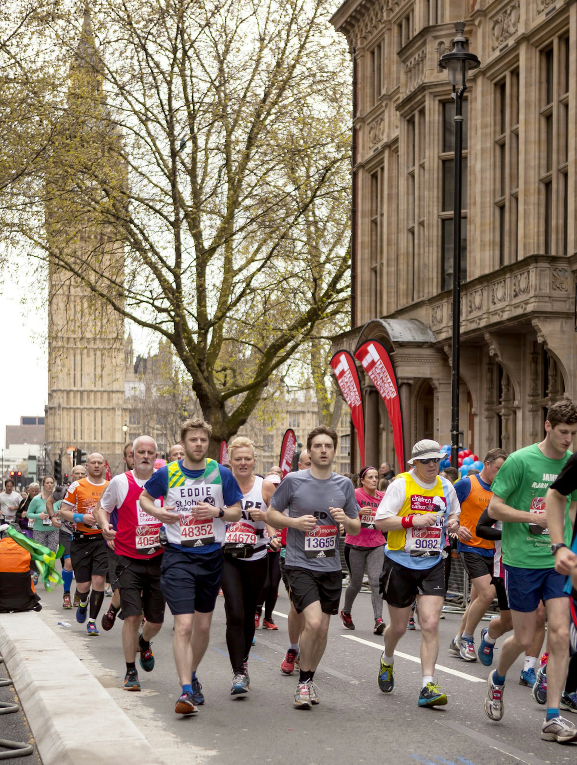 Runners pass the Houses of Parliament during the London Marathon.