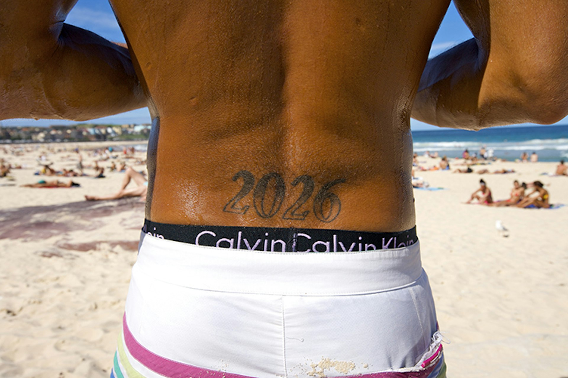 This gent preserved a precious moment... by having the post code of Bondi Beach tattooed in his back. Image by Oliver Strewe / Lonely Planet Images / Getty Images