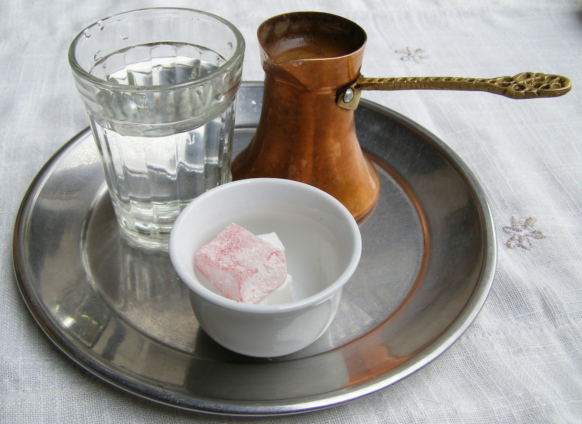 Traditional Bosnian coffee, accompanied by Turkish delight and water. Image by Beatdrifter / Andy Holmes / Getty