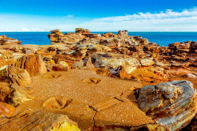 Dinosaur footprints at Broome's Gantheaume Point. Image by Michael Garner / iStock / Getty Images