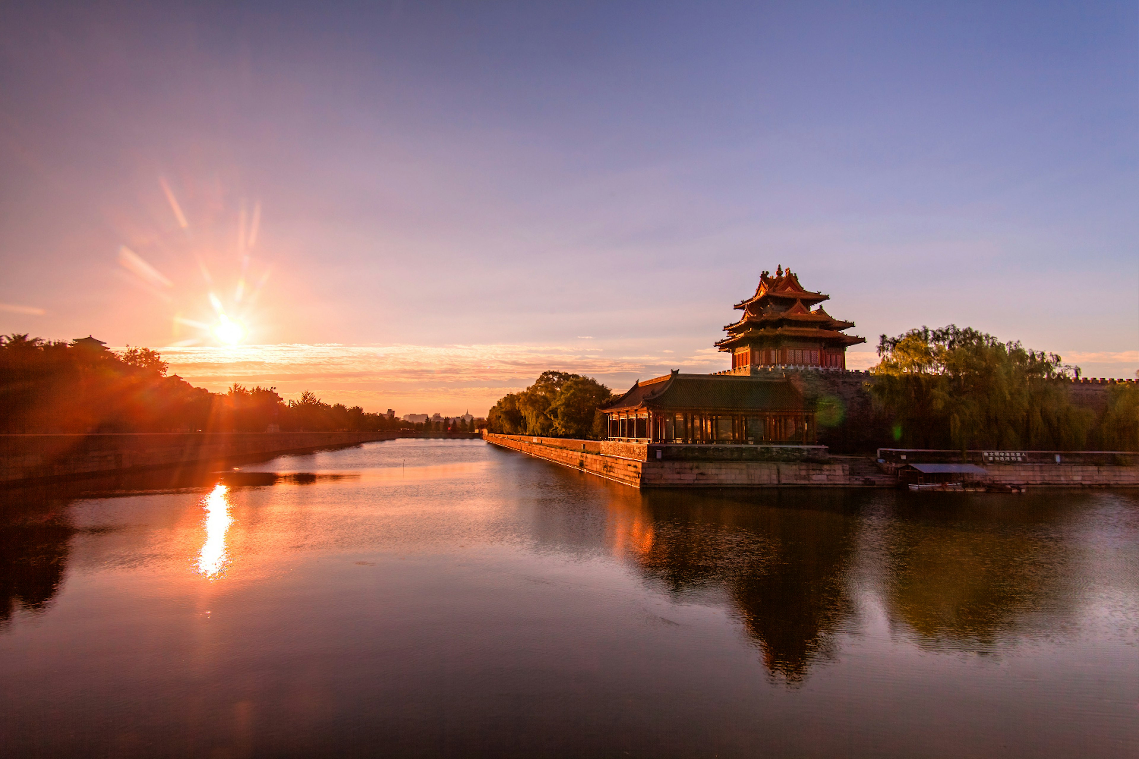 Perfect cheap sundowner: wine along the Forbidden City's moat. Image by CZQS2000 / STS / Getty