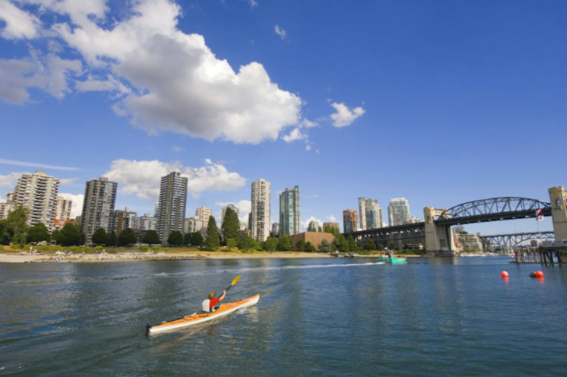 A paddle down Vancouver's False Creek is a great way to see the city. Image by Chris Cheadle / All Canada Photos / Getty Images
