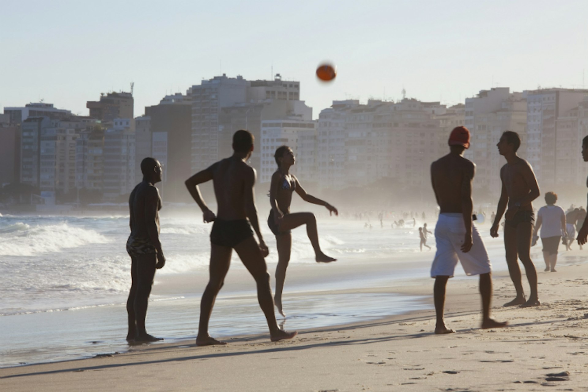 Joining a kickabout on Copacabana is a top Rio experience. Image by Peter Adams / Photolibrary / Getty Images