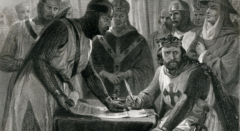 An 1873 engraving shows King John reluctantly signing the Magna Carta. Image by Traveller 1116 / Getty