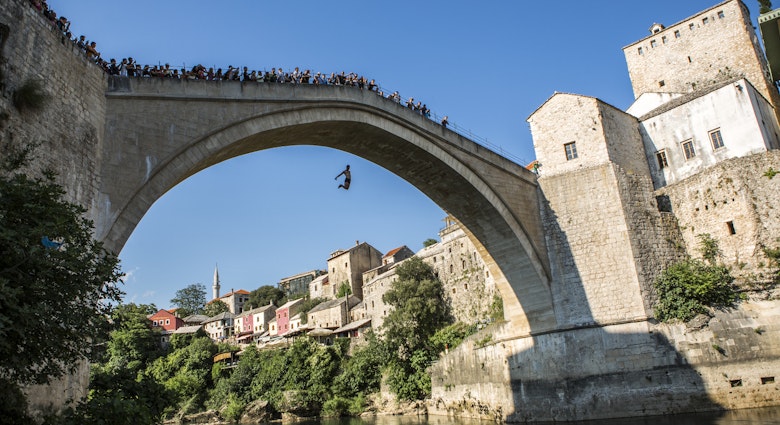 Jumping from Mostar's Stari Most. Image by Tim E White / Getty