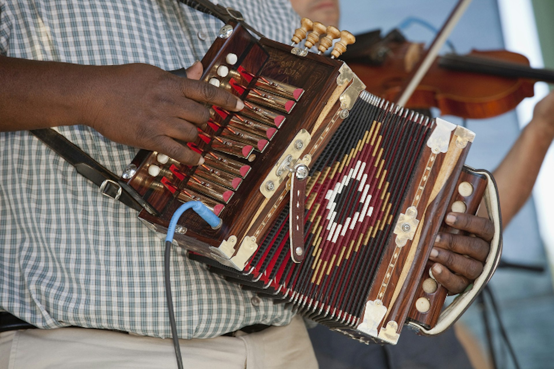 Cajun band playing at the Festivals Acadiens et Creoles in Lafayette. Image by Judy Bellah / Lonely Planet Images / Getty Images 
