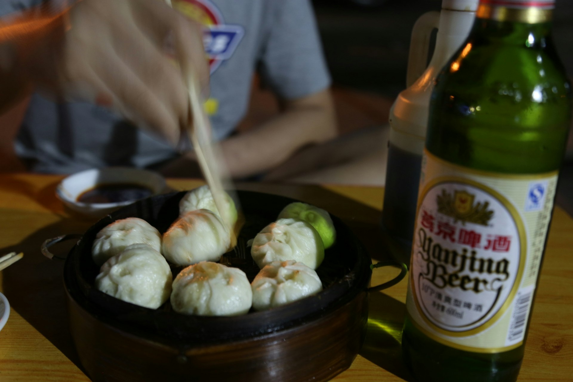 Dumplings and beer: a perfect cheap dinner. Image by Agang-yargyi / Lonely Planet