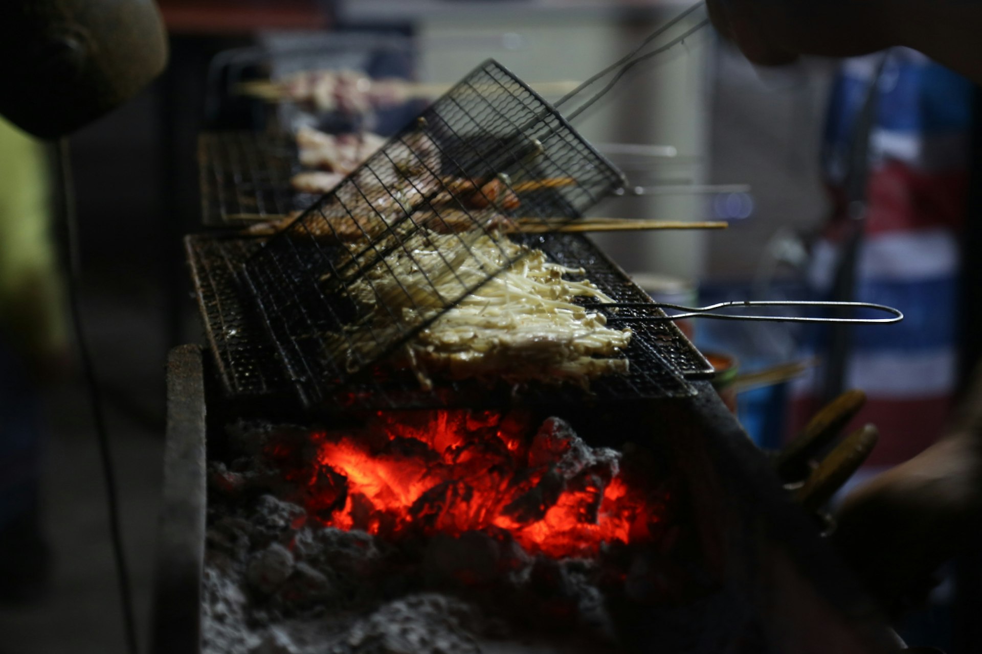 Streetside grills are cheap and ubiquitous in Beijing. Image by Agang-yargyi / Lonely Planet