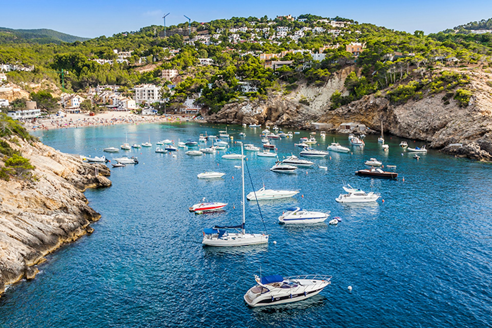 Ibiza's coastline is dotted with pretty bays for families to explore. Image by Lukasz Janyst / Shutterstock