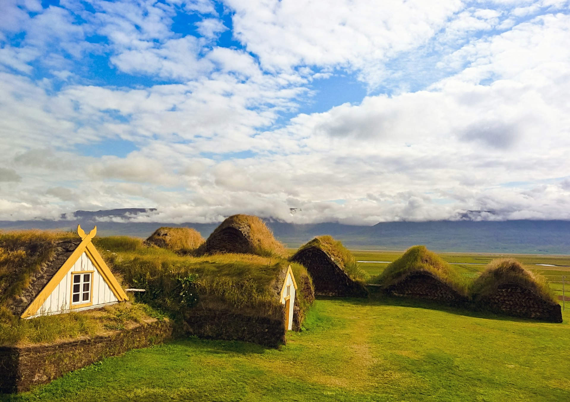 Traditional turfed, low-lying Icelandic houses evolved from Viking longhouses. Image by Rigamondis / iStock / Getty