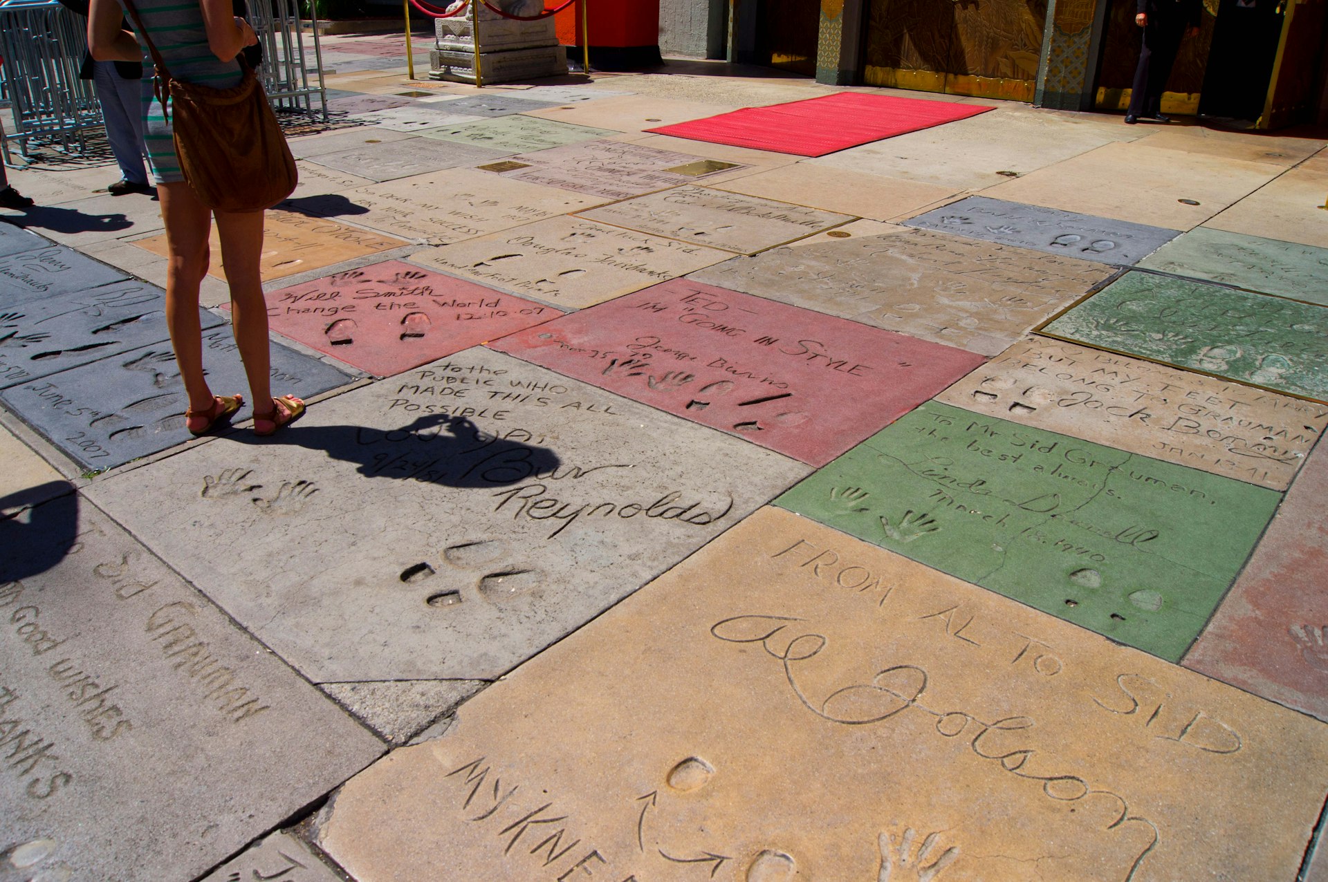 The hand- and footprints on Hollywood Boulevard are always provide a top photo opportunity. Image by Mark Williamson / Getty
