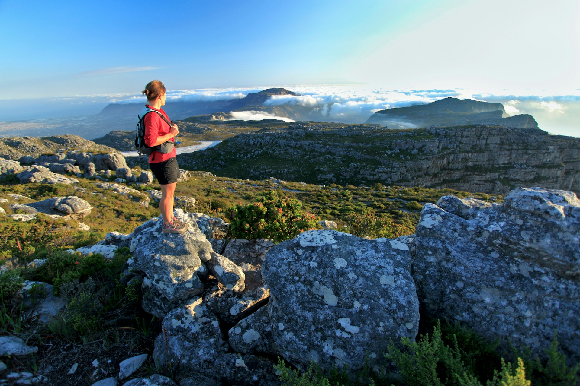 Hiker atop Table Mountain, Cape Town, South Africa. Image by Jacques Marais / Getty