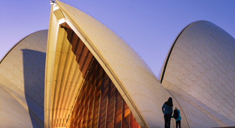 Admiring the Sydney Opera House at dusk. Image by Shaun Egan / Getty Images