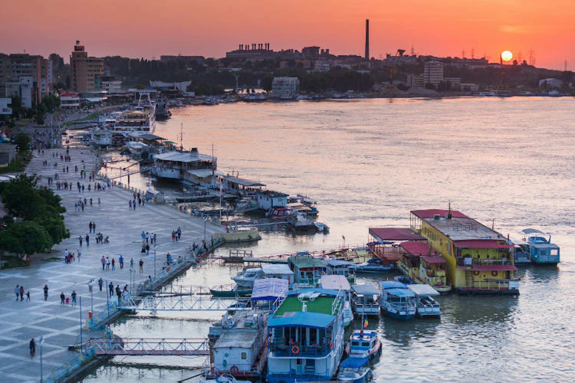 Sun setting over Tulcea port on the Danube. Image by Walter Bibikow / The Image Bank / Getty Images