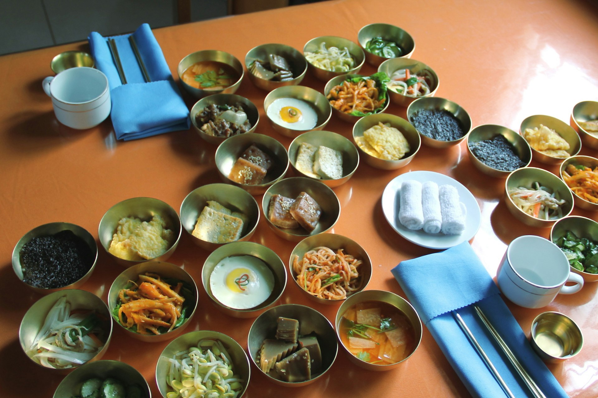 A typical tourist's lunch in North Korea includes small dishes like kimchi, tofu and egg. Image by Lonely Planet 